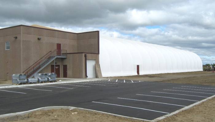 Fabric structure for ice rinks